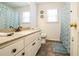 Clean bathroom with vanity, granite counter, patterned shower curtain and tiled floor at 7740 Berea Rd, Winston, GA 30187