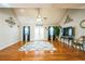 Bright living room featuring vaulted ceilings, hardwood floors, decorative wall art, and a ceiling fan at 7740 Berea Rd, Winston, GA 30187