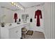 Bathroom featuring a spacious vanity, patterned wallpaper, and a bright ambiance at 1070 River Valley Dr, Dacula, GA 30019