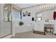 Bathroom featuring a shower, soaking tub, vanity, decorative wallpaper, and a window at 1070 River Valley Dr, Dacula, GA 30019