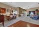 Open concept dining room and living room, with carpet and decorative chandelier at 1070 River Valley Dr, Dacula, GA 30019