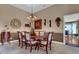 Inviting dining room with traditional chandelier and chair rail at 1070 River Valley Dr, Dacula, GA 30019