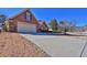 Brick home exterior showing driveway and partial lawn at 1070 River Valley Dr, Dacula, GA 30019