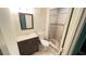 Standard bathroom featuring a vanity with a mirror and a tiled shower with curtain at 497 Prince Of Wales, Stone Mountain, GA 30083