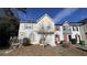 Charming townhouse featuring front lawn and unique front doors at 497 Prince Of Wales, Stone Mountain, GA 30083