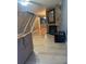 Inviting living room featuring hardwood floors, a stone fireplace, and staircase at 497 Prince Of Wales, Stone Mountain, GA 30083