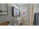 Updated bathroom featuring a modern vanity with a white countertop and stylish mirror at 744 Dean Way, Lawrenceville, GA 30044