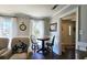 Charming breakfast nook featuring a round table, comfortable seating, and natural light from the windows at 744 Dean Way, Lawrenceville, GA 30044