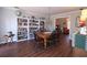 Elegant dining room with a chandelier, large dining table, and built-in bookshelves at 744 Dean Way, Lawrenceville, GA 30044