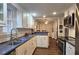 Spacious kitchen featuring white cabinetry, stainless steel appliances, and an open floor plan at 744 Dean Way, Lawrenceville, GA 30044