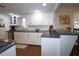 Bright kitchen features white cabinets, modern appliances, and a breakfast bar at 744 Dean Way, Lawrenceville, GA 30044