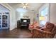 Comfortable living room featuring a piano, sitting area, and view into an adjacent room at 744 Dean Way, Lawrenceville, GA 30044