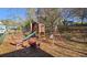 Backyard playground with a slide and swings provides a fun space for outdoor activities at 744 Dean Way, Lawrenceville, GA 30044