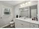 Bathroom with a modern vanity, large mirror, and great natural lighting at 992 Yemassee Trl, Stone Mountain, GA 30083