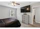 Bedroom featuring carpet, ceiling fan, a large window, and built in storage at 992 Yemassee Trl, Stone Mountain, GA 30083