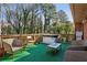 The wooden deck with a hot tub and patio furniture at 992 Yemassee Trl, Stone Mountain, GA 30083