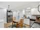 Eat-in kitchen features a dining area, stainless steel appliances, and tile flooring at 992 Yemassee Trl, Stone Mountain, GA 30083