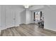 Bedroom featuring a gray wood-look floor and a functional desk area by a window at 359 Bay Hill Ct, Lawrenceville, GA 30043