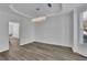 Elegant dining room features a modern chandelier and wood floors with crown molding at 359 Bay Hill Ct, Lawrenceville, GA 30043