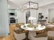 Dining area with hardwood floors open to the kitchen with stainless steel appliances at 835 Fox Valley Dr, Stone Mountain, GA 30088