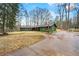 Well-maintained single story home featuring a long driveway and serene natural surroundings at 13356 Panhandle Rd, Hampton, GA 30228