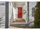 Close up of red front door with brick entry and brick facade at 1686 Niskey Lake Sw Rd, Atlanta, GA 30331