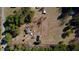 Overhead shot of a countryside home with expansive land, trees, and outbuildings at 5570 Bold Springs Rd, Dacula, GA 30019