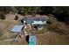 Aerial view of country home back yard showing outbuildings, chicken coop and fenced area at 5570 Bold Springs Rd, Dacula, GA 30019
