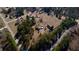 Bird's eye view of a serene property featuring a home, barn, and surrounding trees at 5570 Bold Springs Rd, Dacula, GA 30019