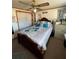 Cozy bedroom with wood-frame bed, ceiling fan, and built-in shelving at 5570 Bold Springs Rd, Dacula, GA 30019