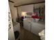 A conveniently located laundry room including a washer, dryer, and storage cabinets at 5570 Bold Springs Rd, Dacula, GA 30019