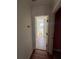 View into bathroom with neutral tile, a bathtub, and a window at 509 Arnold Road, Lawrenceville, GA 30044