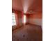 Pink bedroom with wainscoting, carpeted floor, and natural light, creating a charming and inviting space at 509 Arnold Road, Lawrenceville, GA 30044