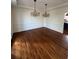 Spacious dining room showcasing hardwood floors, elegant chandelier, and decorative trim at 509 Arnold Road, Lawrenceville, GA 30044