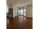 Bright dining room with hardwood floors, a modern chandelier, and large windows offering ample natural light at 509 Arnold Road, Lawrenceville, GA 30044