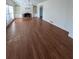 Expansive living room featuring hardwood floors, natural light, a fireplace, and built-in shelving at 509 Arnold Road, Lawrenceville, GA 30044