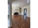 Open living room with hardwood floors, a brick fireplace, and built-in shelving at 509 Arnold Road, Lawrenceville, GA 30044