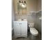 Bathroom with updated vanity and updated lighting at 5157 West St, Covington, GA 30014