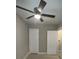 Bedroom with ceiling fan and white doors at 5157 West St, Covington, GA 30014