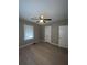 Bedroom with a ceiling fan and wood-look floors at 5157 West St, Covington, GA 30014