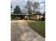 Exterior view of a home with a carport and green yard at 5157 West St, Covington, GA 30014