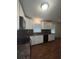 Kitchen featuring updated cabinets and a stainless sink at 5157 West St, Covington, GA 30014