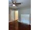 View of a living room featuring original hardwood floors and a non-functioning fireplace at 5157 West St, Covington, GA 30014