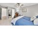 Stylish bedroom featuring neutral walls, ceiling fan, and ample natural light at 5833 Westerling Pl, Powder Springs, GA 30127