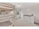 Bright bedroom with bunk beds and a dresser near a window at 5833 Westerling Pl, Powder Springs, GA 30127