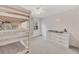 Bedroom featuring bunk beds, a window, and a dresser with changing station at 5833 Westerling Pl, Powder Springs, GA 30127