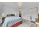 Bedroom with a gray bedspread, closet, and a view to an open door at 5833 Westerling Pl, Powder Springs, GA 30127