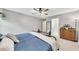 Relaxing bedroom with a ceiling fan, an antique dresser, and a soothing ambiance at 5833 Westerling Pl, Powder Springs, GA 30127
