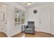 Cozy entryway with hardwood floors, a window with natural light, and comfortable seating at 5833 Westerling Pl, Powder Springs, GA 30127