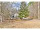Charming one-story home with siding, nestled within a wooded lot at 5833 Westerling Pl, Powder Springs, GA 30127